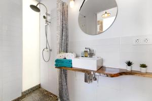a bathroom with a sink and a mirror at Apto Azahara - Casa San Marcial in Triana +17 photos