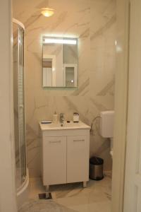 Kúpeľňa v ubytovaní Apartment Brazuca-Center + 22 fotografií