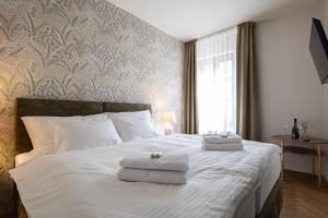 Posteľ alebo postele v izbe v ubytovaní Hotel Tanzberg Mikulov