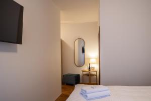 Posteľ alebo postele v izbe v ubytovaní Hotel Tanzberg Mikulov