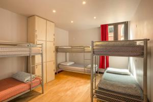 a room with three bunk beds in it at Villa Saint Exupery Beach Hostel in Nice +64 photos