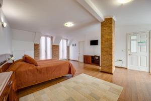 TV a/nebo společenská místnost v ubytování Boutique Hotel