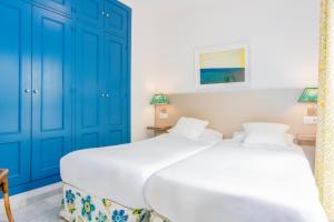 Postel nebo postele na pokoji v ubytování Smartr Sevilla Las Dueñas