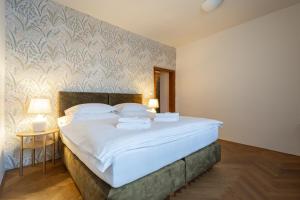 Posteľ alebo postele v izbe v ubytovaní Hotel Tanzberg Mikulov