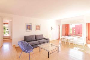 a living room with a couch and a table at Apartment in Muralla Roja - 0413 in Calpe