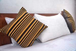 Postel nebo postele na pokoji v ubytování Tropical Garden Homestay Pidurangala