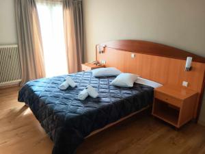 Postel nebo postele na pokoji v ubytování Hotel Liberty