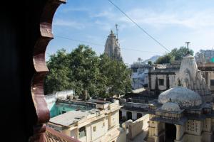 a view of a city from a window at Hotel Udai Niwas By The Lake in Udaipur