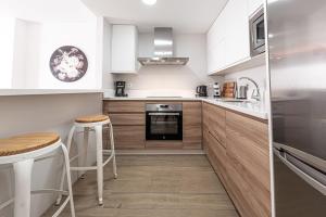 Kuchyň nebo kuchyňský kout v ubytování Hostal Boutique Aurora
