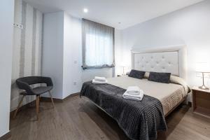 Postel nebo postele na pokoji v ubytování Hostal Boutique Aurora