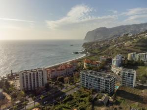 an aerial view of a city and the ocean at Social Lodge - Piornais in Funchal
