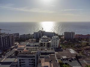 an aerial view of a city and the ocean at Social Lodge - Piornais in Funchal