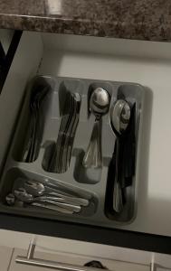 a tray with utensils in a drawer in a kitchen at Proventures Self-catering House in Ondangwa