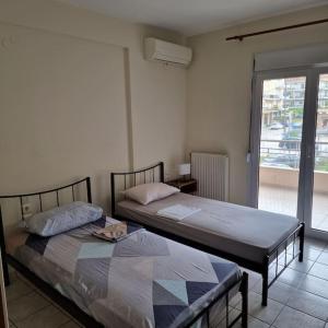 Ένα ή περισσότερα κρεβάτια σε δωμάτιο στο Diana's Cozy 10 Studio