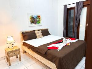 Ένα ή περισσότερα κρεβάτια σε δωμάτιο στο The Koi Guest House