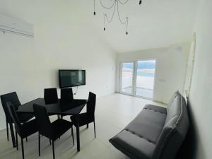 a living room with a table and a couch at Villa Melissa in Pag