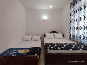 Posteľ alebo postele v izbe v ubytovaní Mango Mango Villa