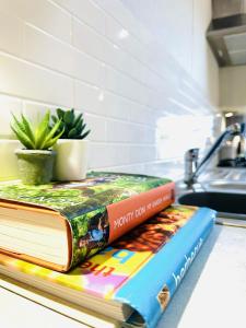 two books sitting on a counter in a kitchen at Ocean Breeze in Filey