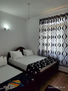 Posteľ alebo postele v izbe v ubytovaní Mango Mango Villa