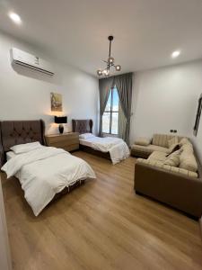 Ένα ή περισσότερα κρεβάτια σε δωμάτιο στο السكن المثالي - alsakan almithaliu