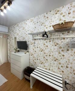 A television and/or entertainment centre at ORTIGIA 26
