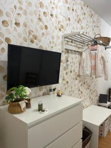 A television and/or entertainment centre at ORTIGIA 26