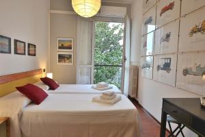 Ένα ή περισσότερα κρεβάτια σε δωμάτιο στο Villa Retrò