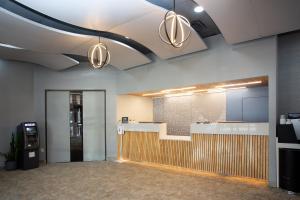 an office lobby with a reception desk and a pay phone at The Barclay Towers Hotel and Resort in Virginia Beach +30 photos