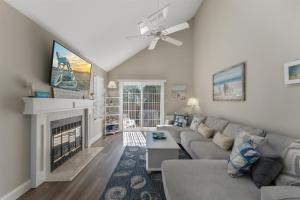 a living room with a couch and a fireplace at 116 Austin Ave in Wildwood