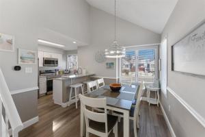 a kitchen and dining room with a table and chairs at 116 Austin Ave in Wildwood