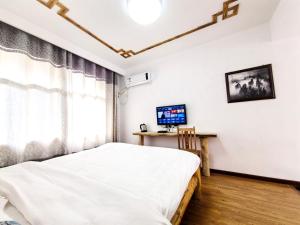 Zhangjiajie YOLO Resort--Within Zhangjiajie National Forest Park客房内的一张或多张床位