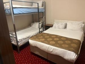 Postel nebo postele na pokoji v ubytování Paris Hotel
