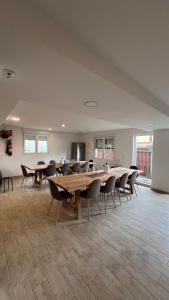 a large room with tables and chairs in it at Albergue de Sonia in Finisterre +38 photos