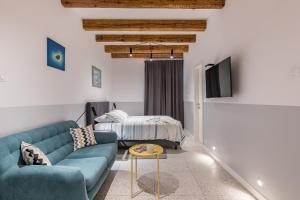 a living room with a couch and a bed at Luxury Studio Adriatic 1 in Split