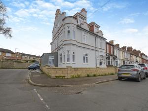 a large white building with cars parked in front of it at No, 2 - Uk46743 in Cromer