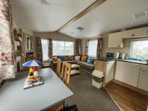 a kitchen and a living room with a caravan at Great 4 Berth Caravan With Wheelchair Access In Suffolk, Ref 68129bs in Lowestoft