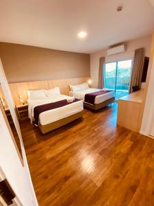Postel nebo postele na pokoji v ubytování Legacy Hotel Guaratinguetá - Ao lado de Aparecida -SP