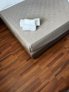 a mattress sitting on top of a wooden floor at Hotel Golden in Rimini