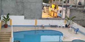 a view of a swimming pool in a building at Hotel Carmita in Atacames