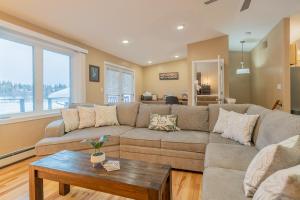 a living room with a couch and a table at The Chena River House North Suite in Fairbanks