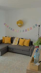 a living room with a couch and a banner on the wall at Fuerteventura Beach Vacations in Puerto del Rosario