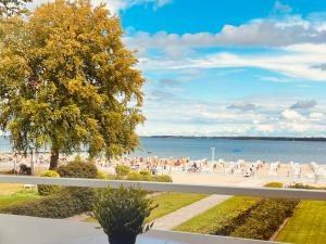 a view of the beach from the balcony of a resort at Strand Suite in Lübeck