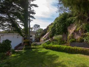 a garden with a hammock in the yard at The Shelter in Malveira da Serra