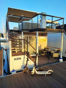 a small house with a deck on a boat at SEA LUX FLOATING HOUSE AJDA Portorose in Portorož