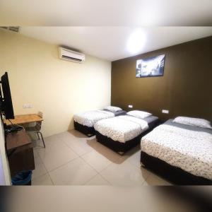 Katil atau katil-katil dalam bilik di Rasah Jaya 11 ppl homestay