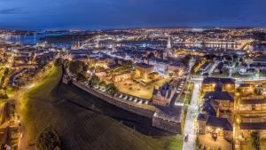 an aerial view of a city at night at Hotel No.9 in Derry Londonderry