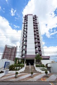 a tall building with stairs in front of it at Travel Inn Saint Charles in Jundiaí