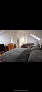 Postel nebo postele na pokoji v ubytování Beaumaris Rooms