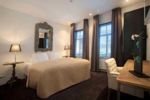 Ένα ή περισσότερα κρεβάτια σε δωμάτιο στο Hotel Mauritz