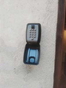 a remote control on the side of a wall at civico 37 in Trevignano Romano
